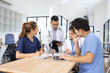 © SOMKID - Medical team brainstorming having a meeting in conference room at hospital, Medical technology and health care concept.