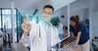 © SOMKID - Medical team with human anatomy on technological digital holographic innovative having a meeting room, Medical technology and health care concept.
