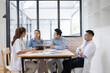 © SOMKID - Medical team having a meeting in conference room at hospital, Medical technology and health care concept.