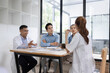 © SOMKID - Medical team having a meeting in conference room at hospital, Medical technology and health care concept.