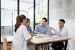 © SOMKID - Medical team having a meeting in conference room at hospital, Medical technology and health care concept.