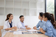 © SOMKID - Medical team having a meeting in conference room at hospital, Medical technology and health care concept.