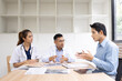 © SOMKID - Medical team having a meeting in conference room at hospital, Medical technology and health care concept.