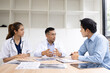 © SOMKID - Medical team having a meeting in conference room at hospital, Medical technology and health care concept.