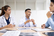 © SOMKID - Medical team having a meeting in conference room at hospital, Medical technology and health care concept.