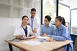 © SOMKID - Medical team having a meeting in conference room at hospital, Medical technology and health care concept.