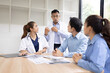 © SOMKID - Medical team having a meeting in conference room at hospital, Medical technology and health care concept.