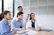 © SOMKID - Medical team having a meeting in conference room at hospital, Medical technology and health care concept.
