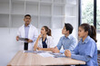 © SOMKID - Medical team having a meeting in conference room at hospital, Medical technology and health care concept.