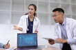 © SOMKID - Medical team with laptop computer and examine x ray test results for treatment plans in a modern hospital, Healthcare and medical concept.