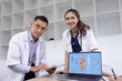 © SOMKID - Medical team with laptop computer and examine x ray test results for treatment plans in a modern hospital, Healthcare and medical concept.