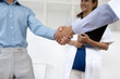 © SOMKID - Doctors shaking hands in meeting room at hospital , Healthcare and medical concept.