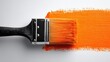 © Fable - Paintbrush applying vibrant orange paint stroke on white background