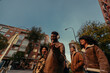 © bernardbodo - Group of young students walking and talking together in the city