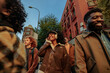 © bernardbodo - Group of young students walking and talking together in the city