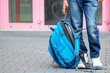© MarKord - Close up of shcool boy (pupil) legs, hands and blue schoolbag  (backpack). Kid standing near schoolhouse. Child ready for new semester (education) in school. Back to school.