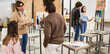 © DisobeyArt - Female teacher working with art students during painting class at university college - Back to school and campus lifestyle concept - Soft focus on woman face