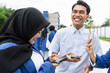© ADDICTIVE STOCK - Asian students sharing a joyful moment on campus