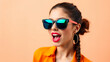 © RajendraPonang - A vibrant young woman wearing stylish sunglasses posing confidently