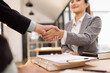 © SOMKID - Lawyer Handshake in Business Meeting, Agreement and Partnership, Hammer of Justice,