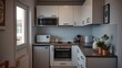 © Leo - Modern compact kitchen with essential appliances, showcasing a clean and functional residential space.