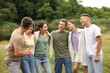 © New Africa - Team building. Group of happy people together outdoors