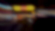 © Adrenaloby - Abstract blurred urban night lights with warm yellow and orange tones creating a dreamy bokeh effect for backgrounds