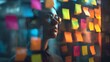 © Palash Mahmud - Creative business strategist analyzing project tasks on a scrum board with colorful adhesive notes.