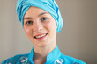 © A Stock Studio - Close up face. Portrait of a beautiful young east woman. Woman in blue colored clothes and turban of the east asian type.