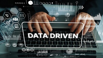Aufkleber - Business Professional Analyzing Data with Laptop Surrounded by Digital Graphs and Infographics in Modern Workspace Environment. Asymptotic smart data analytic.