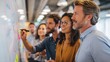 © Johannes - Diverse group of focused work colleagues writing on a whiteboard during a planning and strategy meeting in a bright modern office, no logos, no brands
