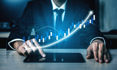 Poster - A businessman focuses on financial data displayed on a tablet, with a dynamic stock market graph illustrating growth and trends in a modern office setting. Impute