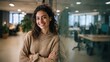 © Johannes - Young smiling latin girl college student or teacher looking at camera standing in university campus. Happy hispanic millennial woman professional posing in modern coworking creative office space., no