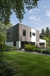 © gamespirit - Contemporary architecture presents a beautifully designed house featuring sleek lines and modern aesthetics, perfectly situated within a landscaped garden.