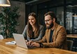 © sujon1638 - Focused business professionals collaborating on a laptop project at a modern office workspace table