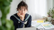 © bephoto - 女子中学生が資料を見ながら思案