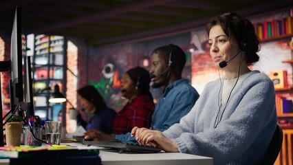 Poster - Customer support employees listening to clients issues. Teamworking call center agents in front of PC in office using headset mic to provide helpful solutions, solving customers concerns, camera B