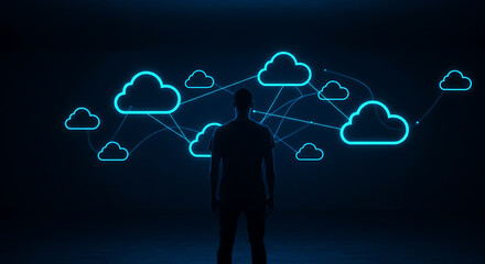 Poster - Digital Architect Contemplating the Cloud: A solitary figure stands before a digital network of interconnected cloud icons, illuminated against a deep blue backdrop, symbolizing data.
