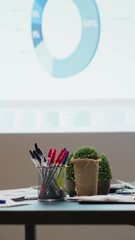 Poster - Vertical Video Professional workspace in a multinational enterprise shows an empty dark office after hours, glowing with data insights, forecasting projections and digital charts for business planning