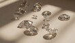 © miss irine - Loose diamonds of various cuts, sizes scattered on light surface. Dramatic shadows cast by gems add depth, highlight brilliance. Arrangement suggests luxury, value, meticulous process of diamond