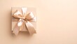 © chocoPhotos - ベージュの背景に置かれた、サテンリボンが美しいギフトボックスGenerated image