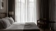 © Aries Li - Stylish hotel room with crisp linens and morning sunlight filtering through sheer curtains.