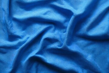 Blue sports fabric texture background, close-up of blue jersey cloth