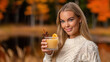 © Olena - A woman with a Hugo Spritz, a delightful  Autumn cocktail to enjoy outdoors.