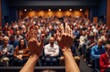 © starush - Audience raising hands during a presentation in a conference hall