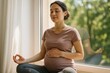 © Yves - Serene Pregnant Woman Embracing Wellness and Mindfulness Through Meditation, Perfect for Prenatal Health and Wellbeing Campaigns