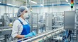 © Nazlykhan - Female worker in food processing plant monitoring equipment in hygienic gear