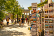 © robertharding - View of Brandenburg Gate, postcards and visitors in Pariser Platz on sunny day, Mitte, Berlin, Germany