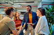 © we.bond.creations - Business team collaborating and shaking hands during a productive meeting in a modern office, fostering partnership and teamwork