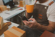 © Chadaporn - a packer is working in a room at a shipping company, an entrepreneur is a small business owner selling small items online, a businessman is working in his shipping company, parcel, product